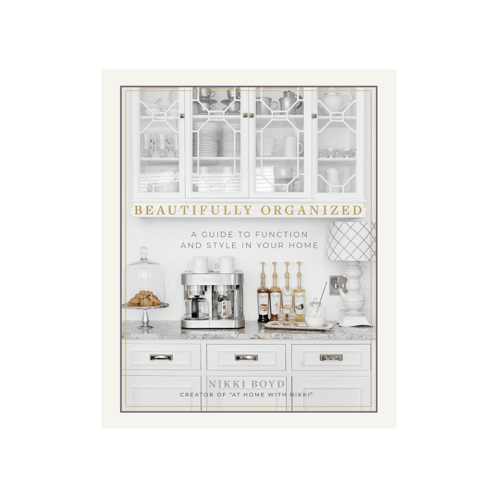 Beautifully Organized by Nikki Boyd, a guide to function and style for a slow living and mindful home. Book cover featuring a bright, orderly white kitchen coffee station with glass-front cabinets and gold accents.